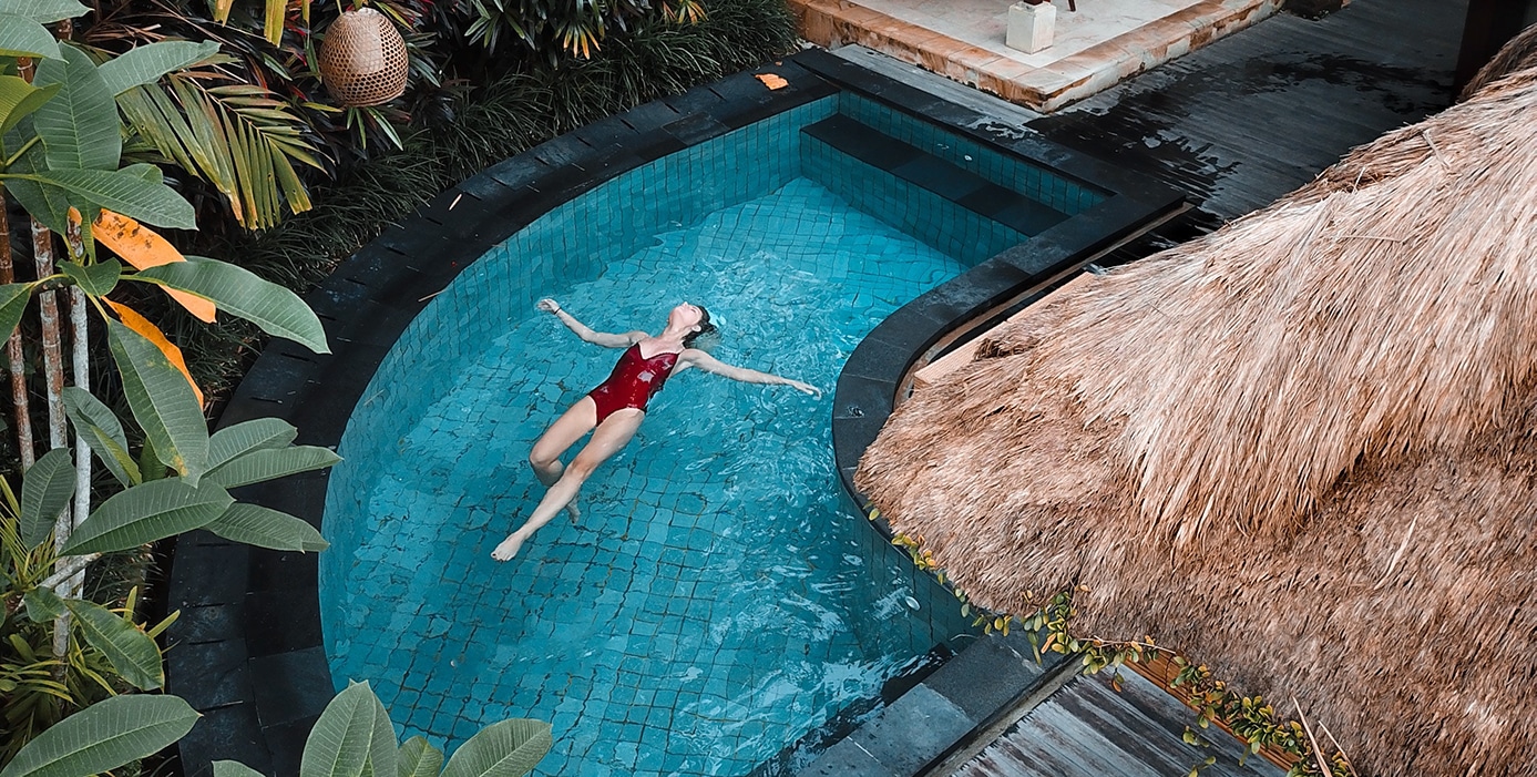 Women on Vacation Floating in Pool